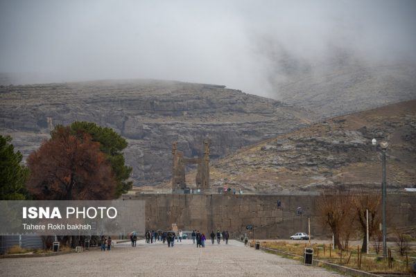 Iranian people visiting Persepolis under the rain 1