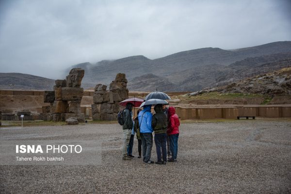 Iranian people visiting Persepolis under the rain 17