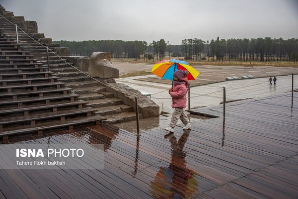 Iranian people visiting Persepolis under the rain 2