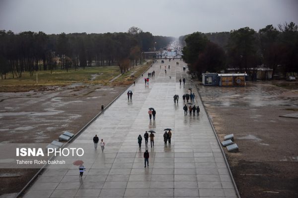 Iranian people visiting Persepolis under the rain 3