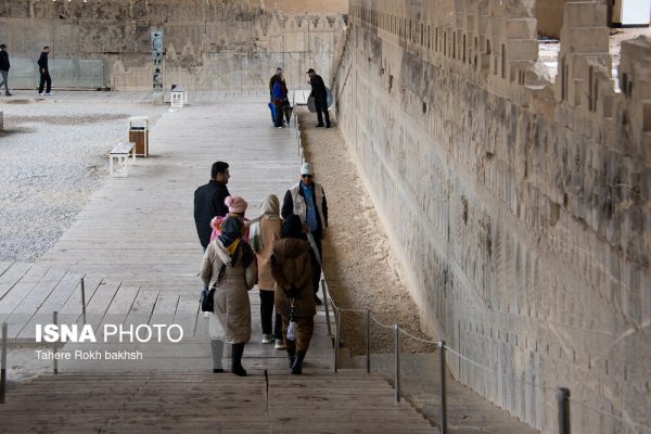 Iranian people visiting Persepolis under the rain 57