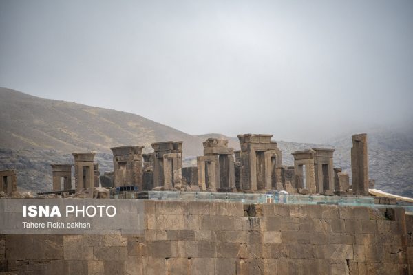 Iranian people visiting Persepolis under the rain 58